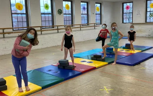 a group of children on mats