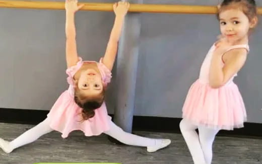 a couple of girls doing yoga