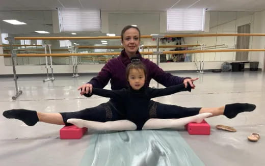 a person and a child exercising