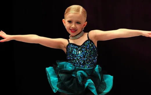 a girl in a blue dress