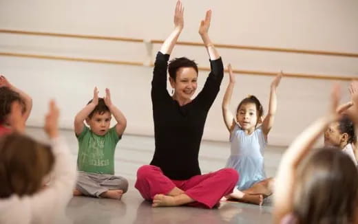 a group of children doing yoga