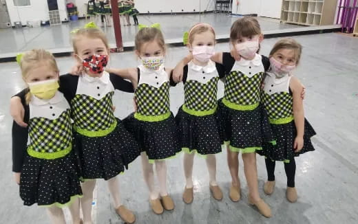 a group of girls wearing clothing