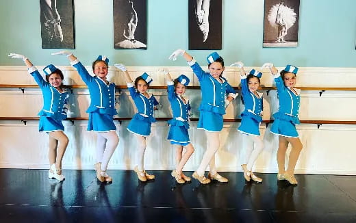 a group of girls in blue uniforms