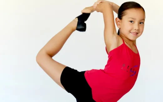 a woman posing with her arms up
