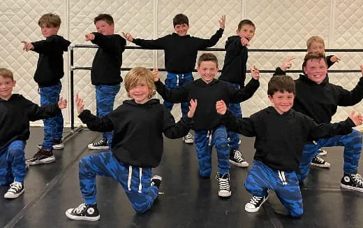a group of kids posing for a photo
