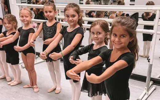 a group of girls posing for a photo