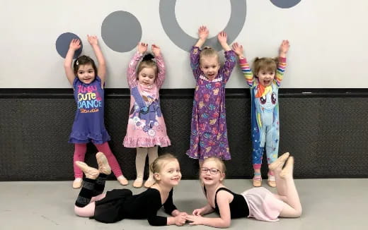 a group of children posing for a photo