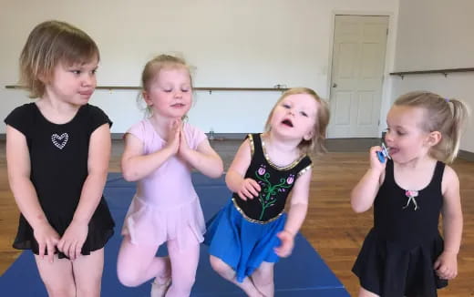 a group of girls posing for a picture