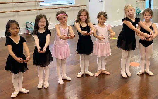 a group of girls posing for a photo