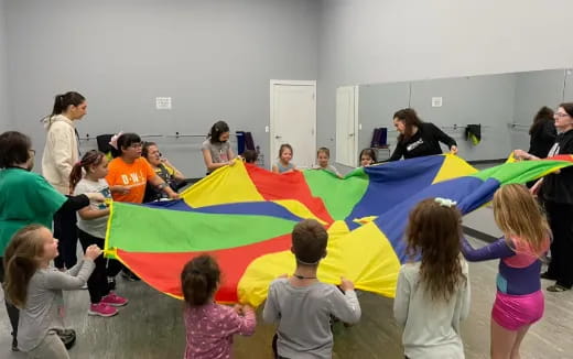a group of children holding a flag