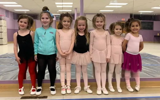 a group of girls posing for a photo