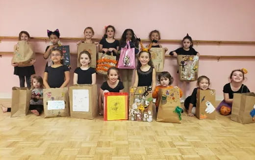 a group of children holding boxes