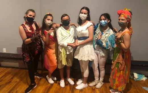 a group of people wearing masks