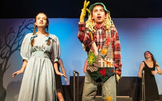 a man and woman on stage