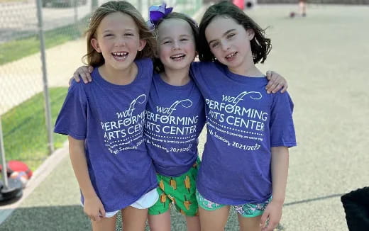 a group of girls posing for a picture