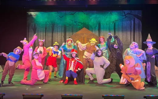 a group of people in clothing dancing