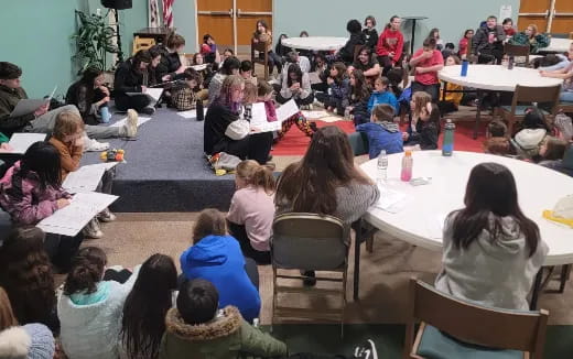 a group of people sitting at tables