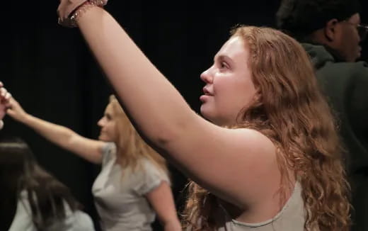 a woman with her arms raised
