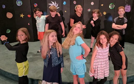 a group of children on a stage