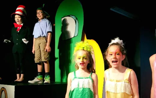 a group of children on a stage