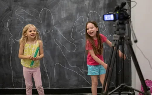 a couple of girls on a stage