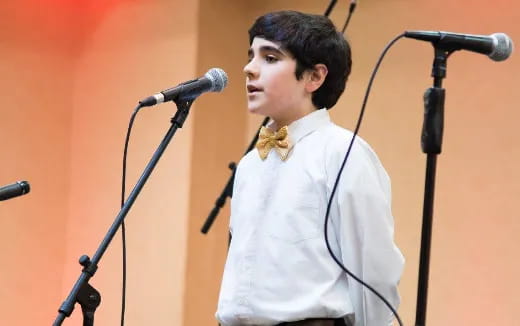 a person standing in front of a microphone