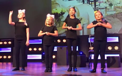 a group of women on a stage