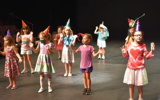 a group of children wearing clothing