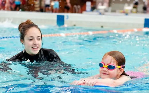 a couple of girls in a pool