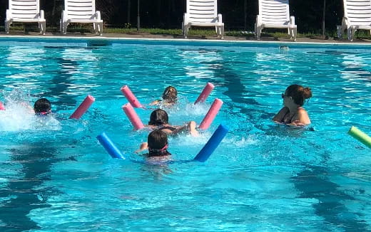 a group of people in a pool