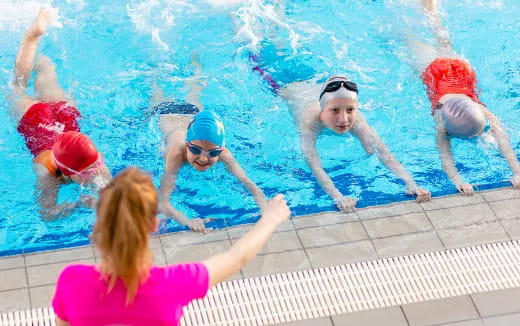a group of people in a pool