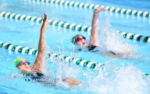 a man swimming in a pool