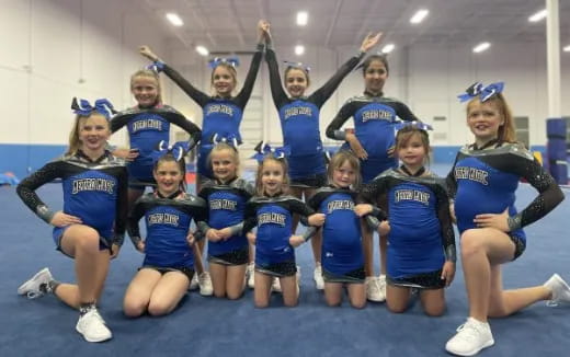a group of cheerleaders posing for a photo