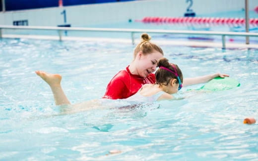 a man and woman in a pool