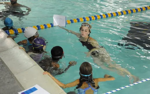a group of people in a pool