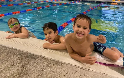 a group of kids in a pool