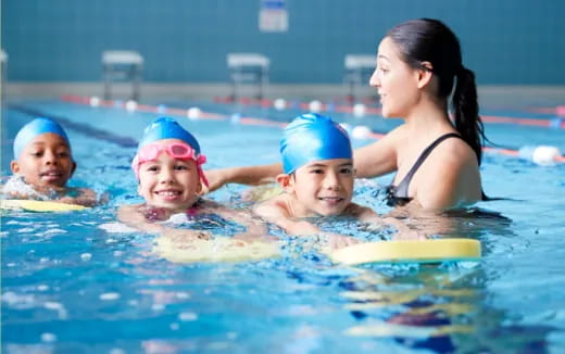 a group of people in a pool