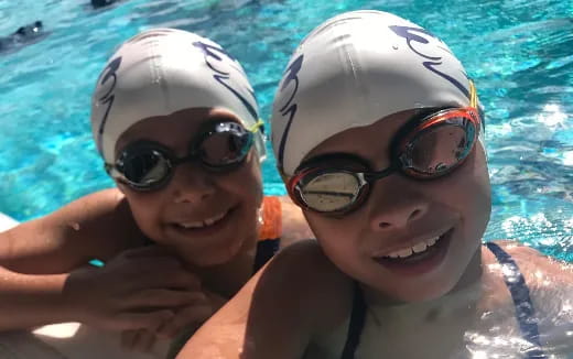 a couple of people in a pool