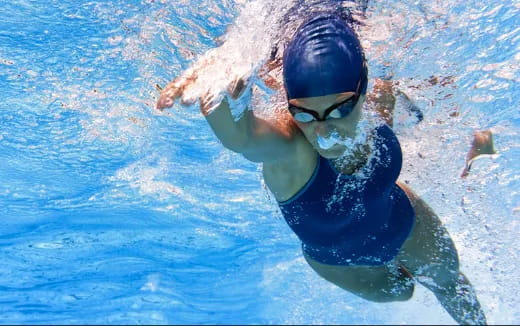 a person swimming in a pool