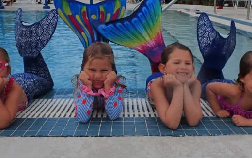 a group of children in a pool