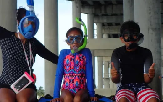 a group of people wearing masks