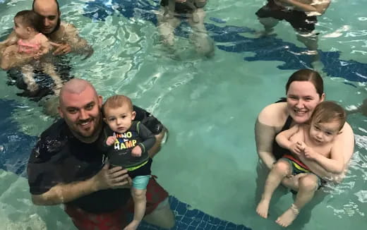 a group of people in a pool
