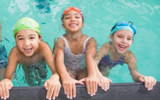a group of children in swimsuits
