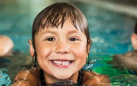 a close-up of a girl smiling