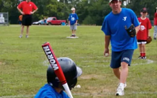 a person holding a baseball bat