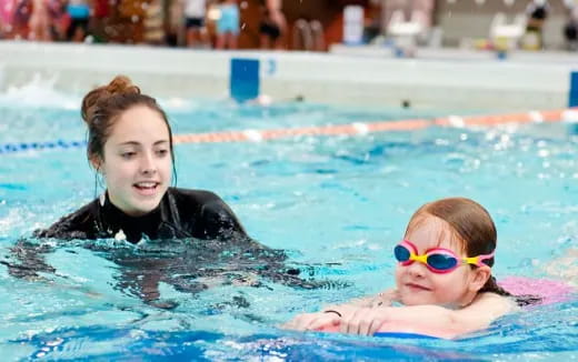 a couple of girls in a pool
