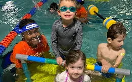 a group of kids in a pool