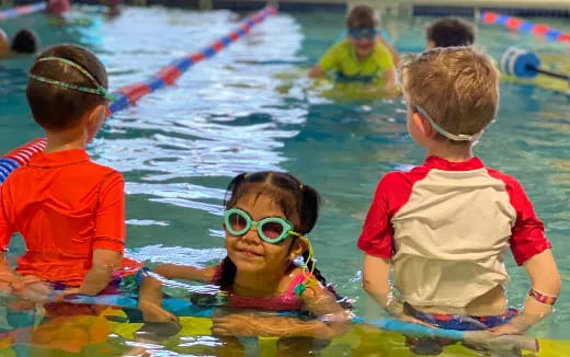 a group of children in a pool