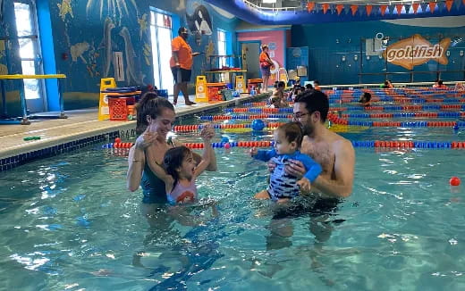a group of people in a pool