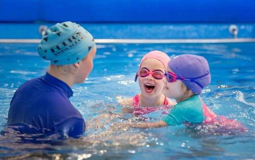 a group of kids in a pool